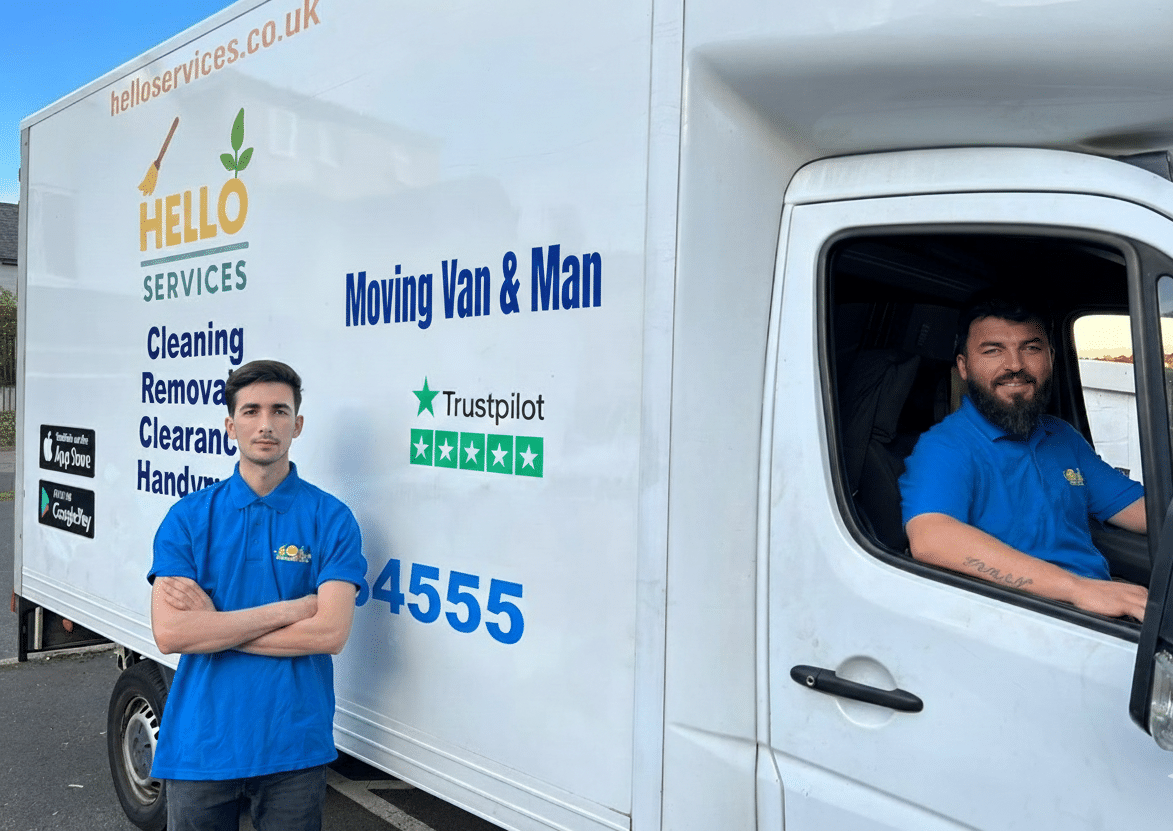 Hello Services man with a van driver standing beside his branded moving van showing the booking phone number